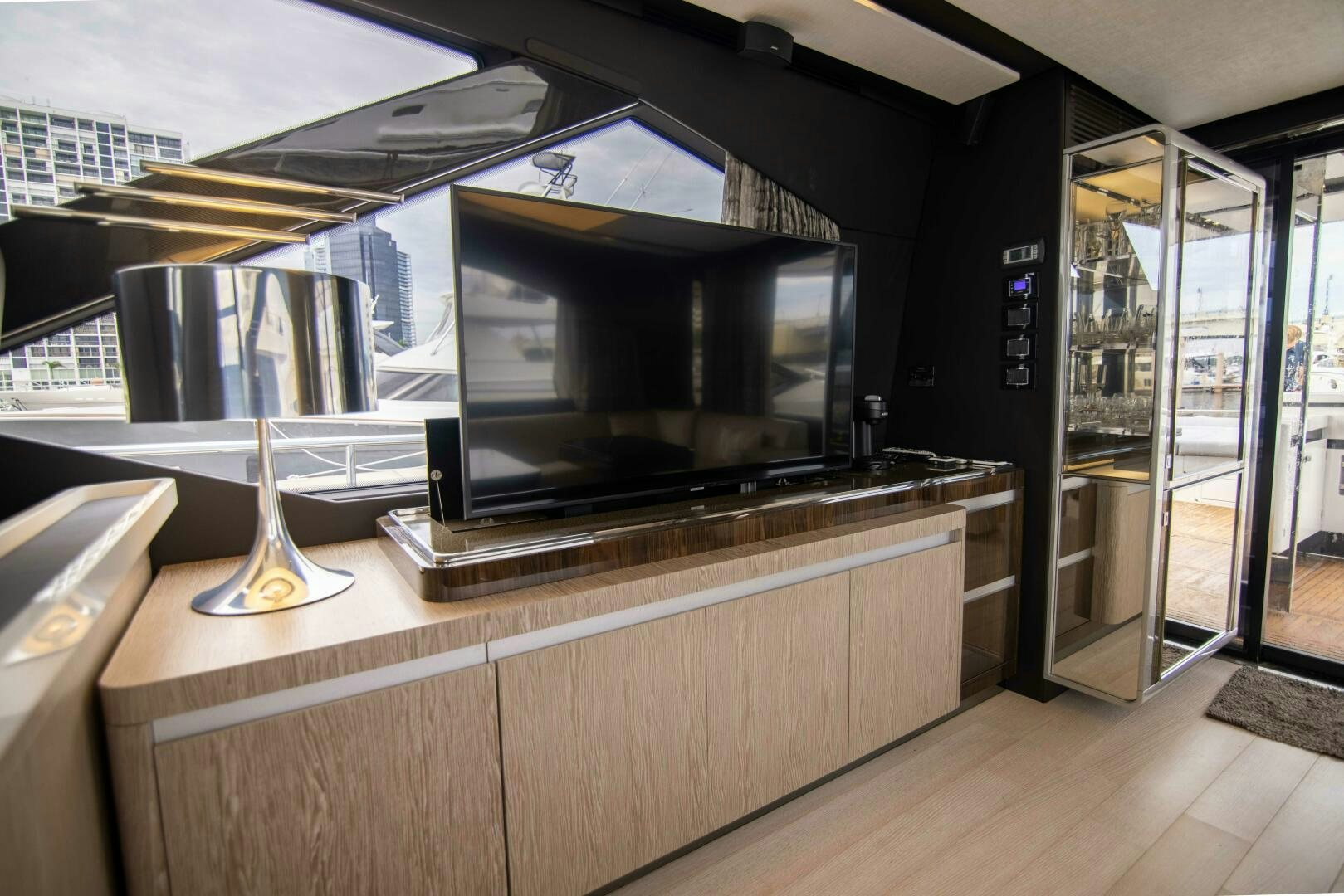 a large tv on a stand aboard TRIPLE PLAY Yacht for Sale