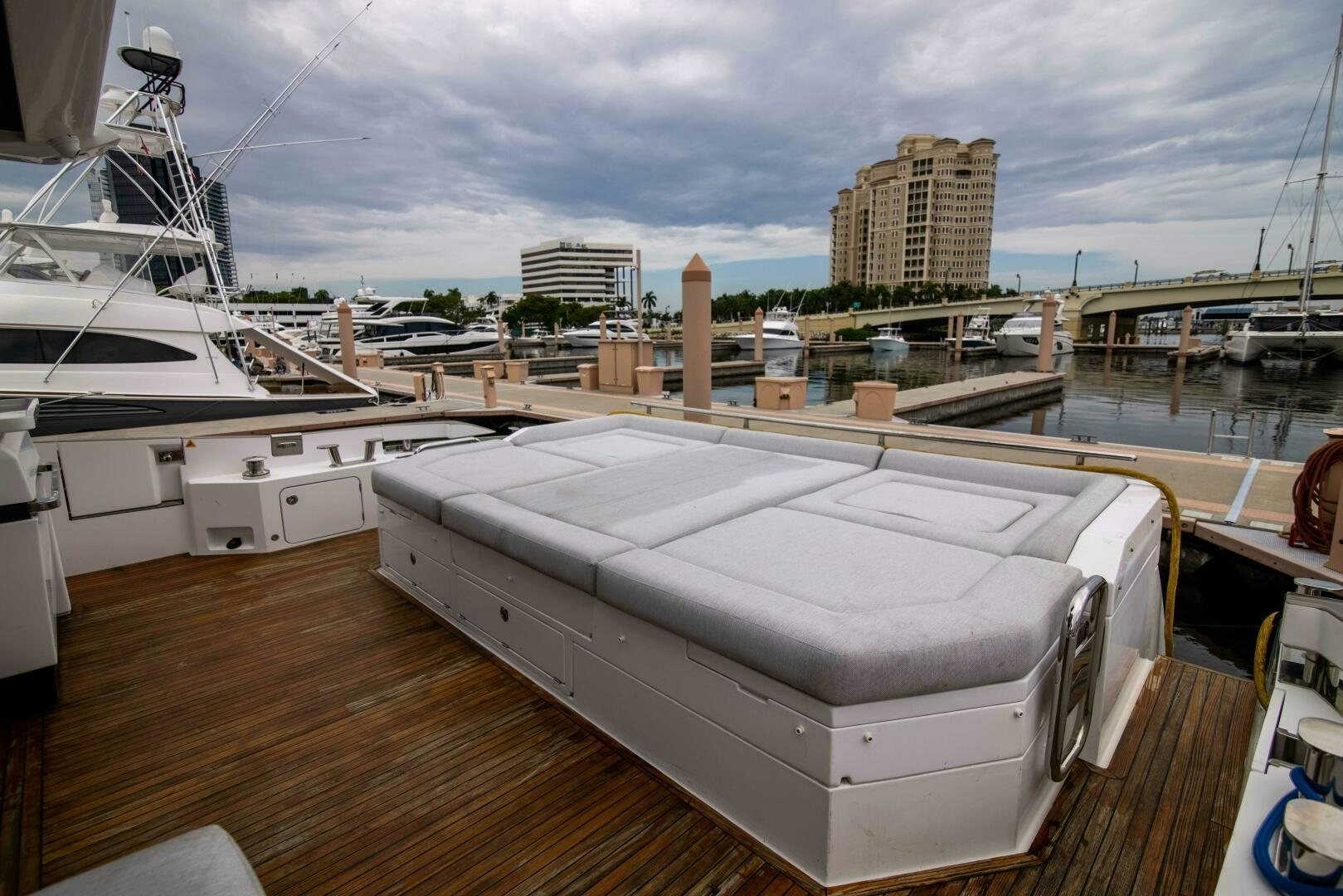 a large white boat on a deck aboard TRIPLE PLAY Yacht for Sale