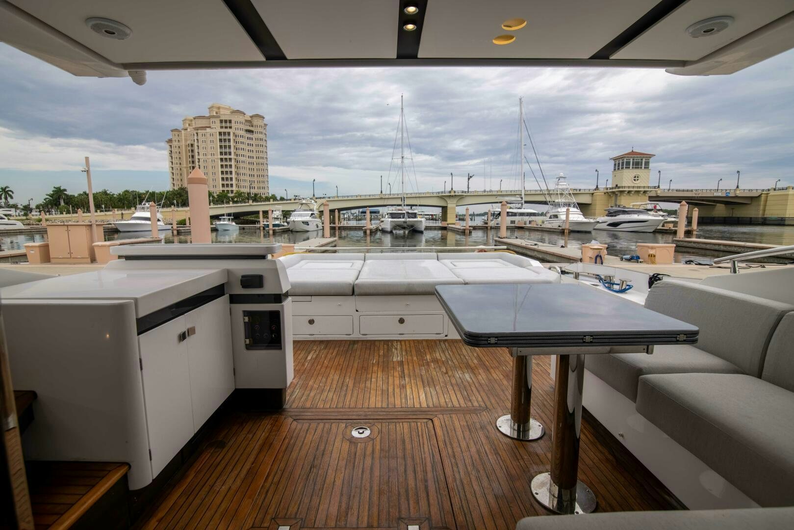 a room with a table and a large window aboard TRIPLE PLAY Yacht for Sale