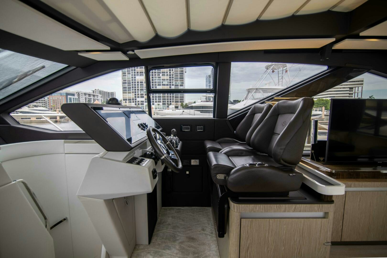 inside of a car aboard TRIPLE PLAY Yacht for Sale