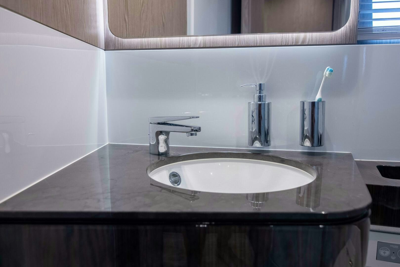 a sink with a faucet aboard TRIPLE PLAY Yacht for Sale