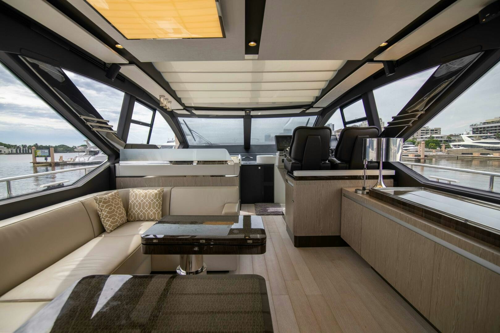 a boat with a couch and a table on it aboard TRIPLE PLAY Yacht for Sale
