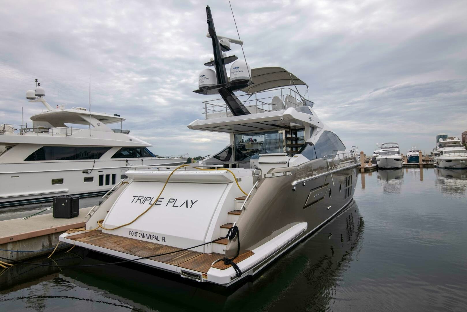 a large boat in the water aboard TRIPLE PLAY Yacht for Sale