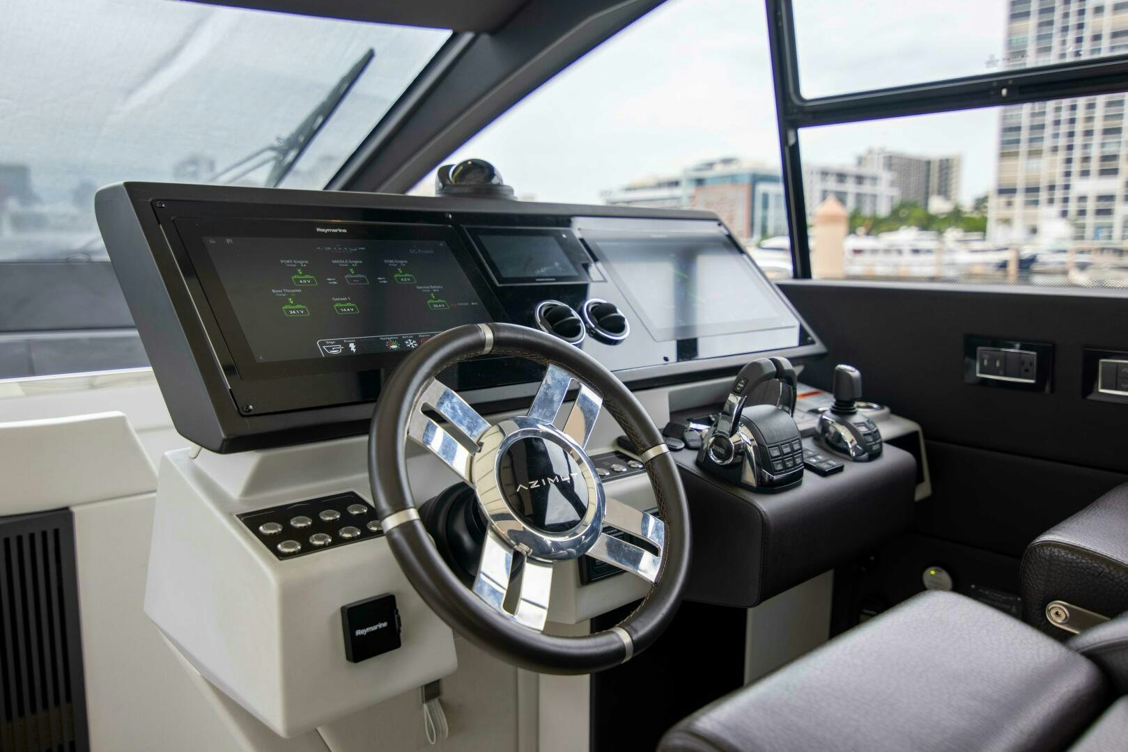 inside of a car aboard TRIPLE PLAY Yacht for Sale