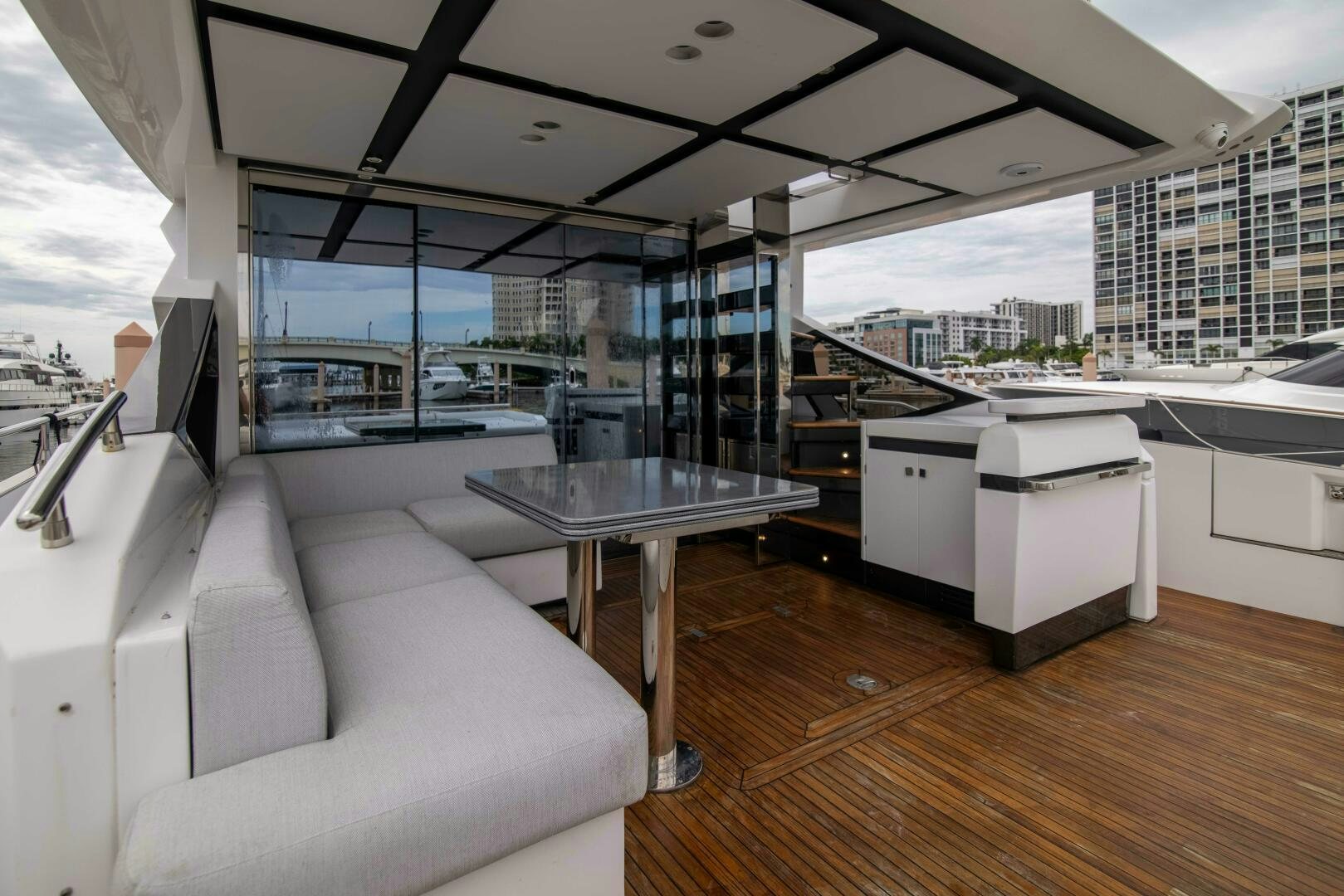 a room with a table and a couch aboard TRIPLE PLAY Yacht for Sale
