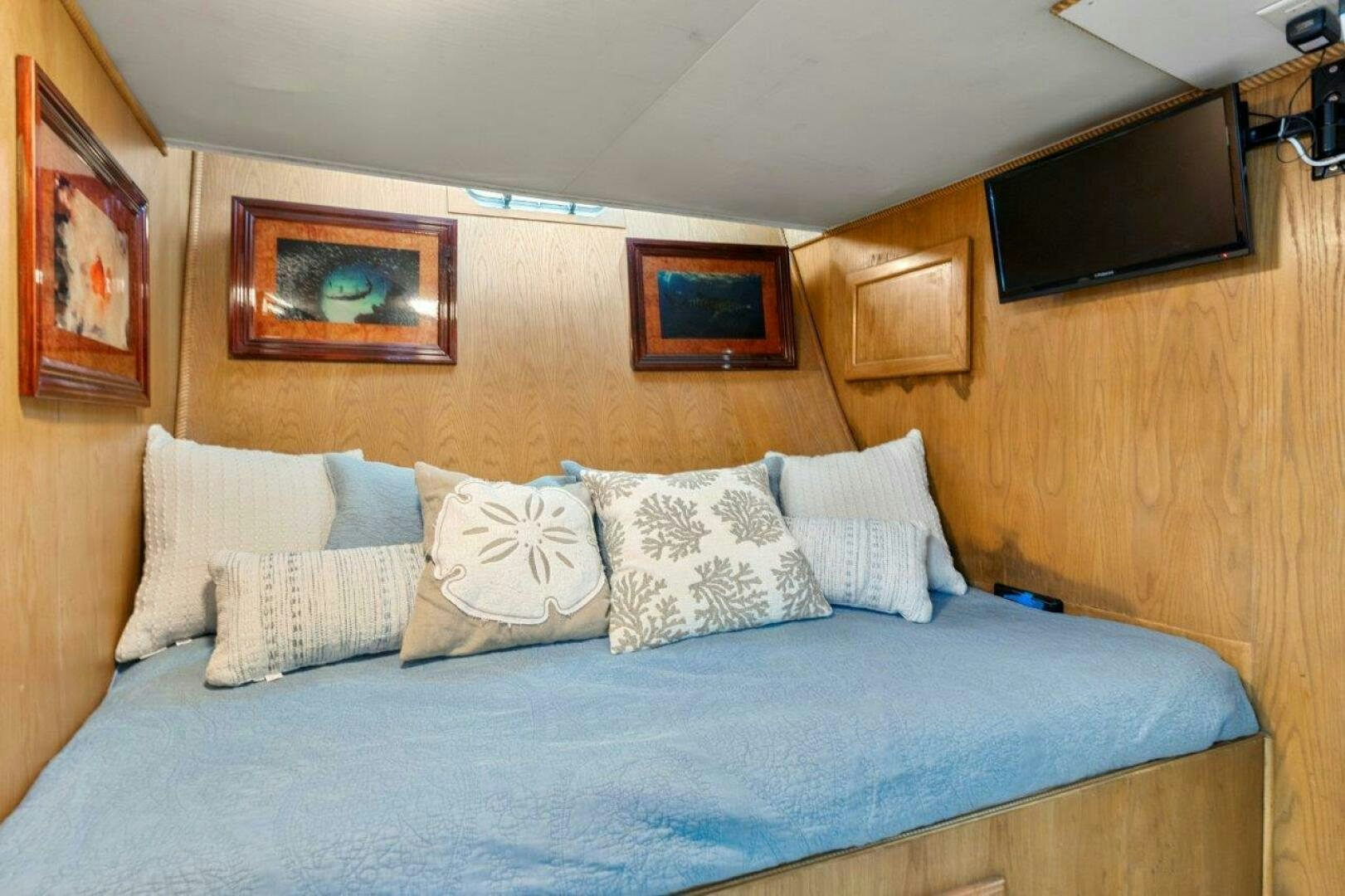 a bed with pillows aboard ENVISION Yacht for Sale