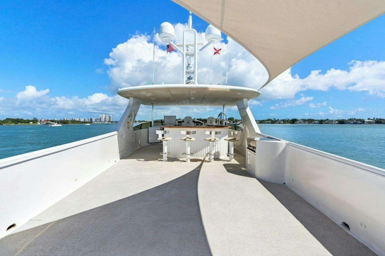 a large white ship on a dock aboard ENVISION Yacht for Sale