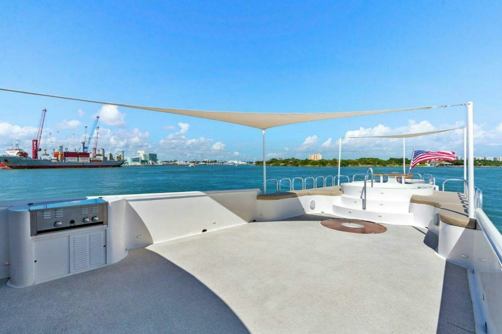 a large white boat on a body of water aboard ENVISION Yacht for Sale