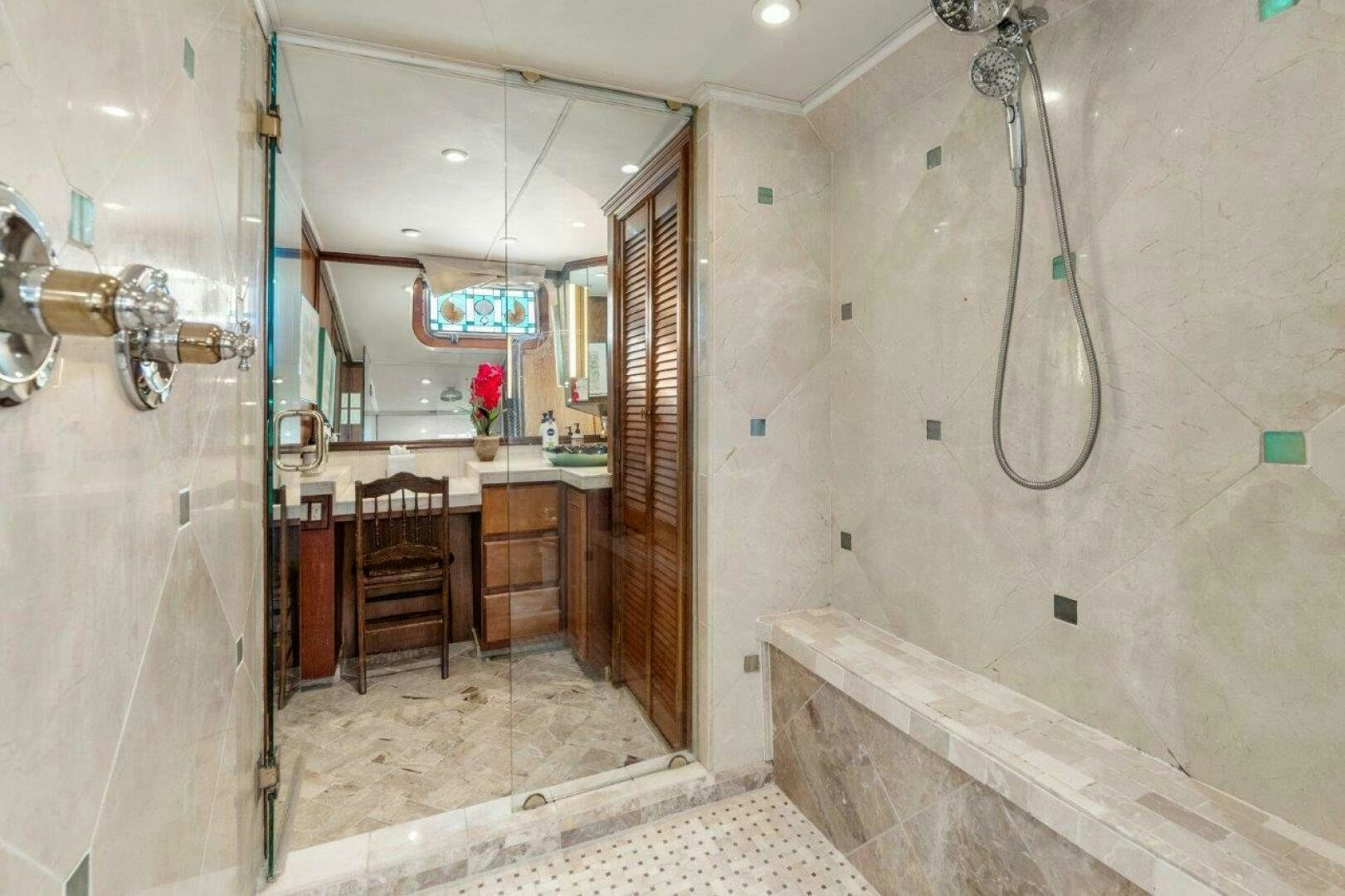 a bathroom with a sink and a mirror aboard ENVISION Yacht for Sale