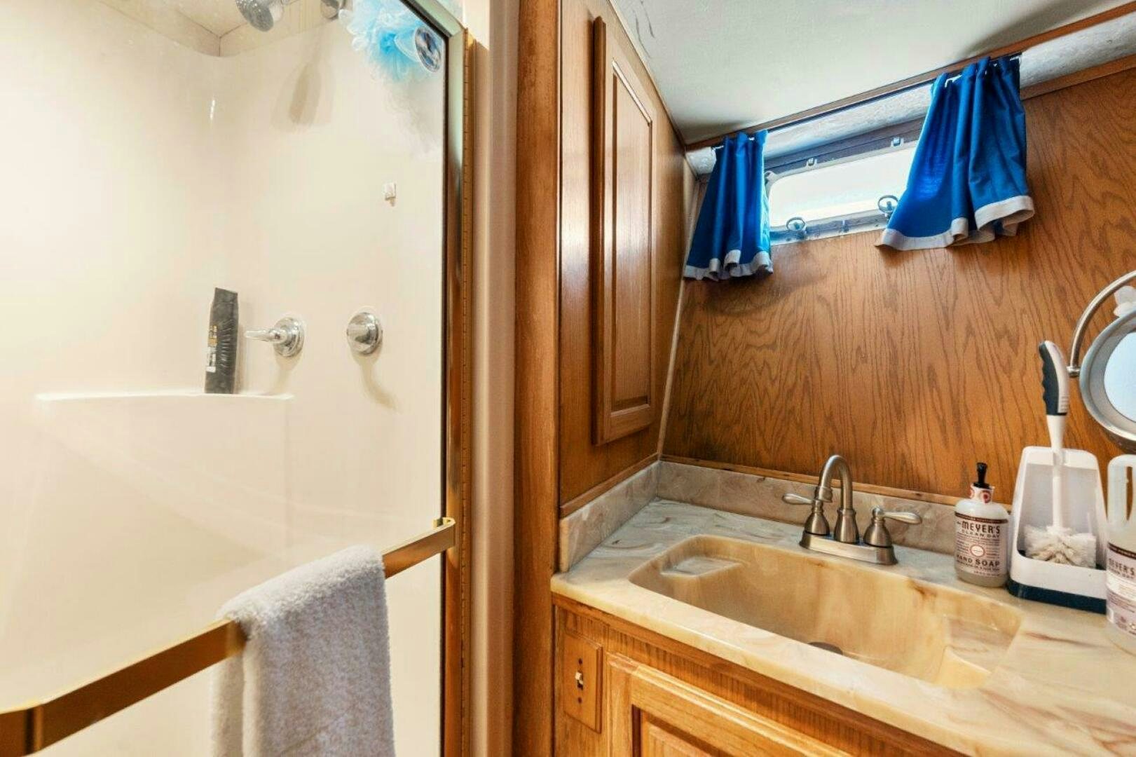 a bathroom with a sink and a mirror aboard ENVISION Yacht for Sale