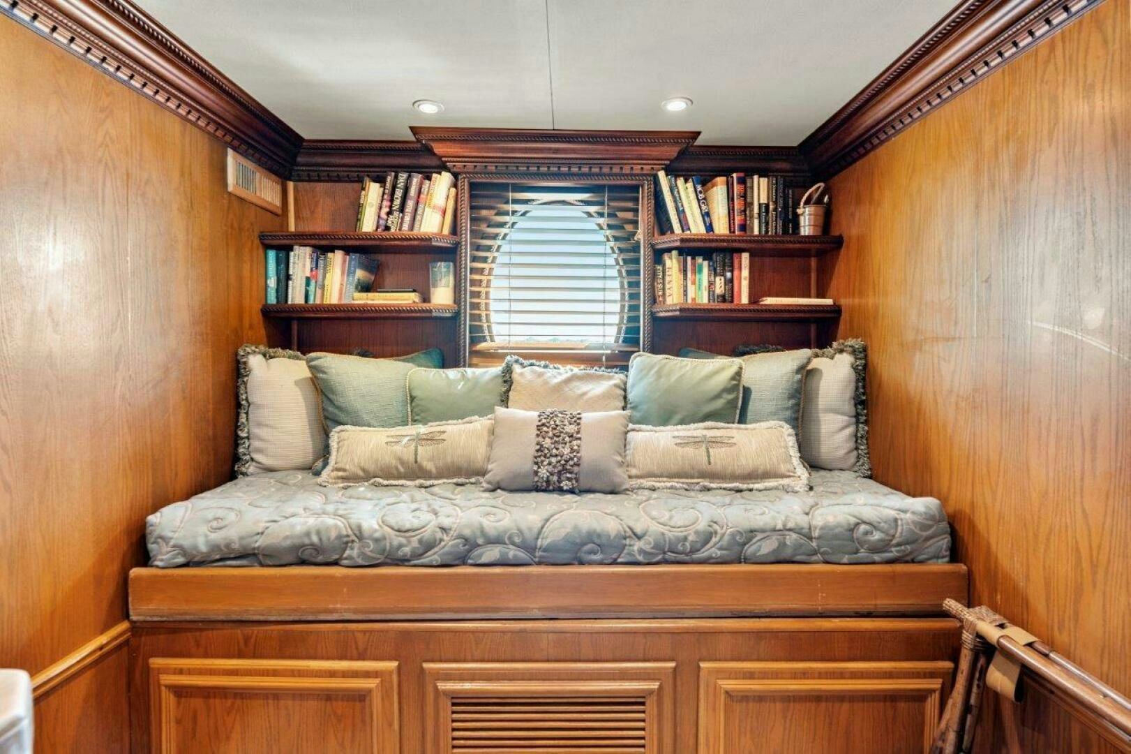 a couch with pillows aboard ENVISION Yacht for Sale