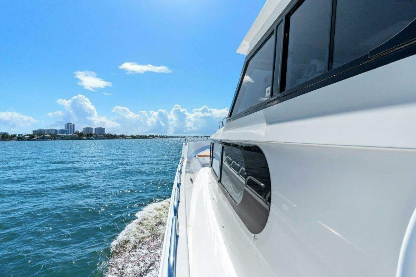 a car driving on a body of water aboard ENVISION Yacht for Sale