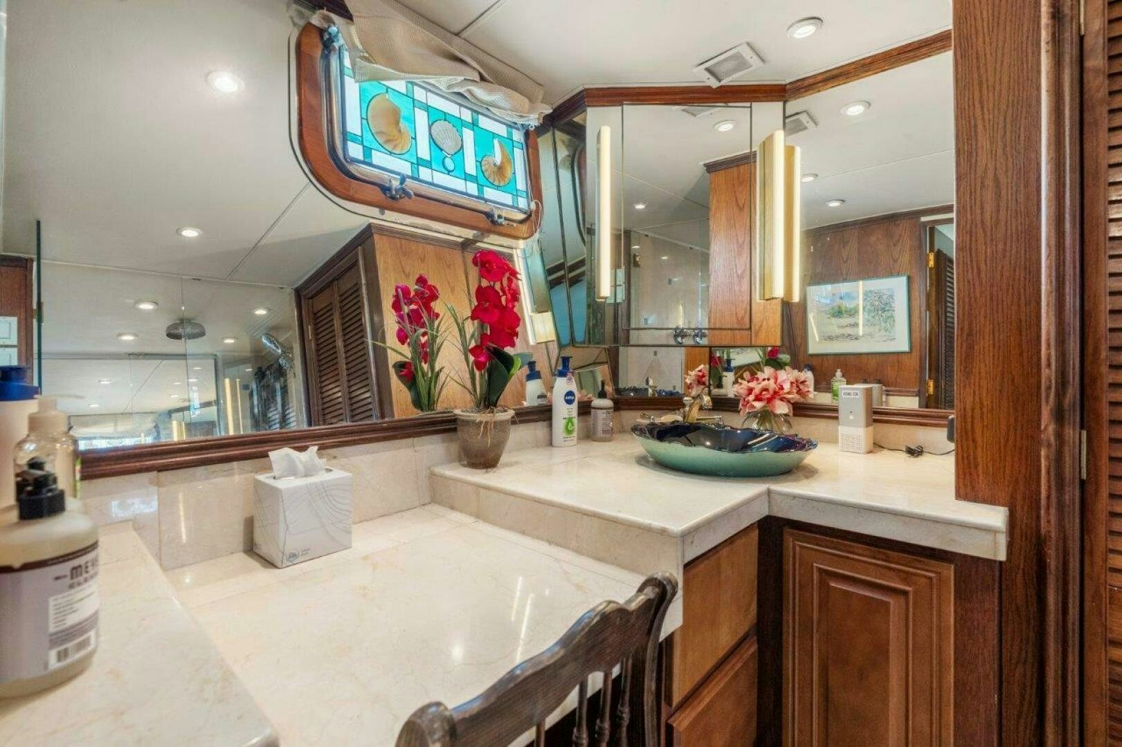 a bathroom with a sink and a mirror aboard ENVISION Yacht for Sale