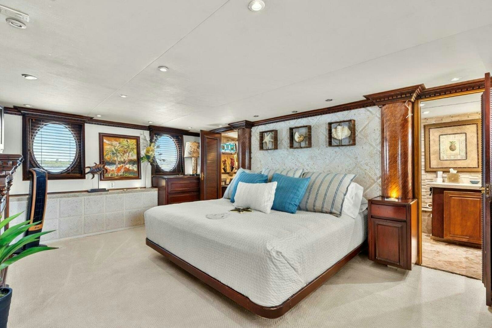 a large bedroom with a large bed aboard ENVISION Yacht for Sale