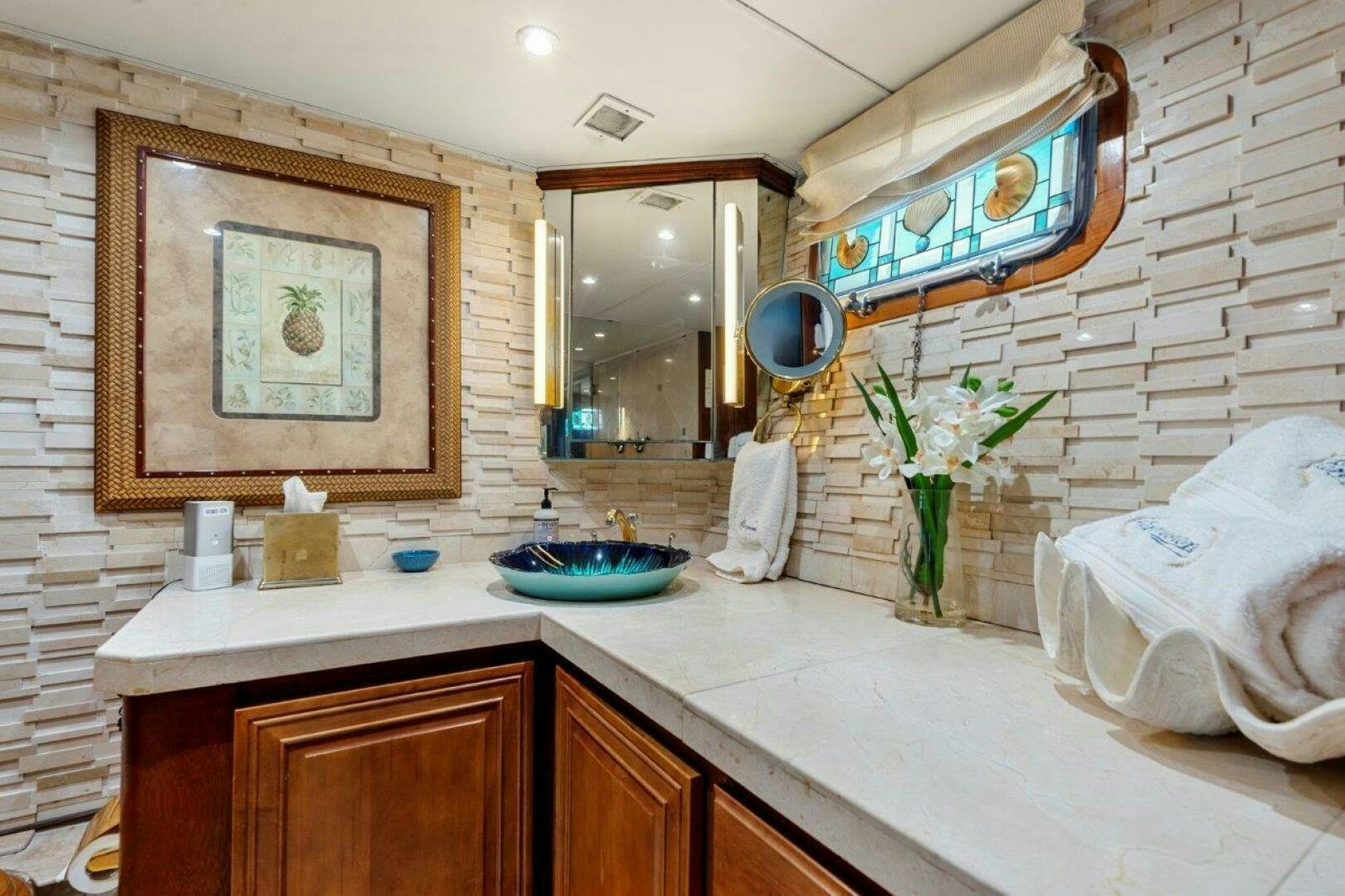 a bathroom with a sink and mirror aboard ENVISION Yacht for Sale