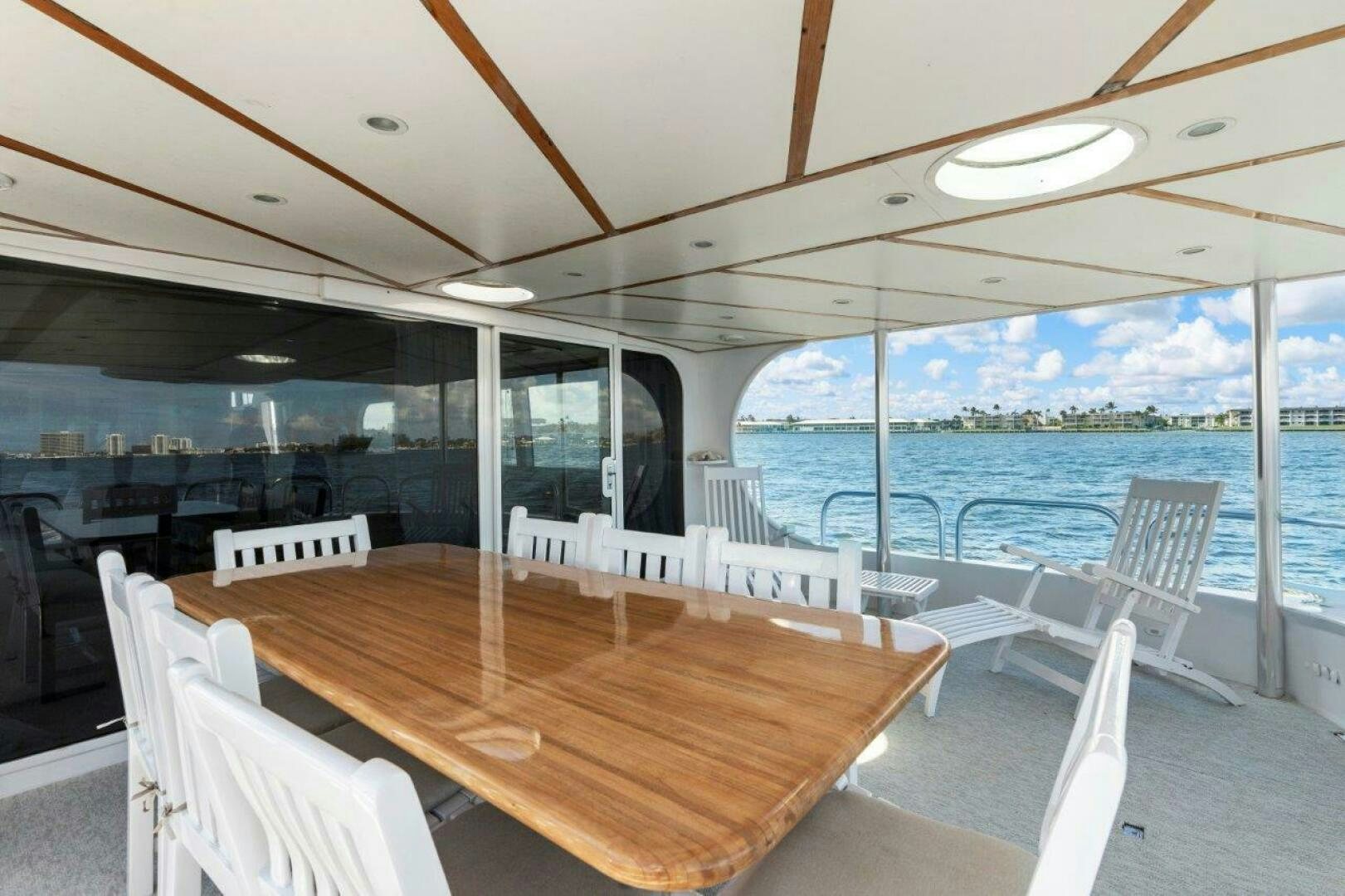 a table and chairs on a boat aboard ENVISION Yacht for Sale