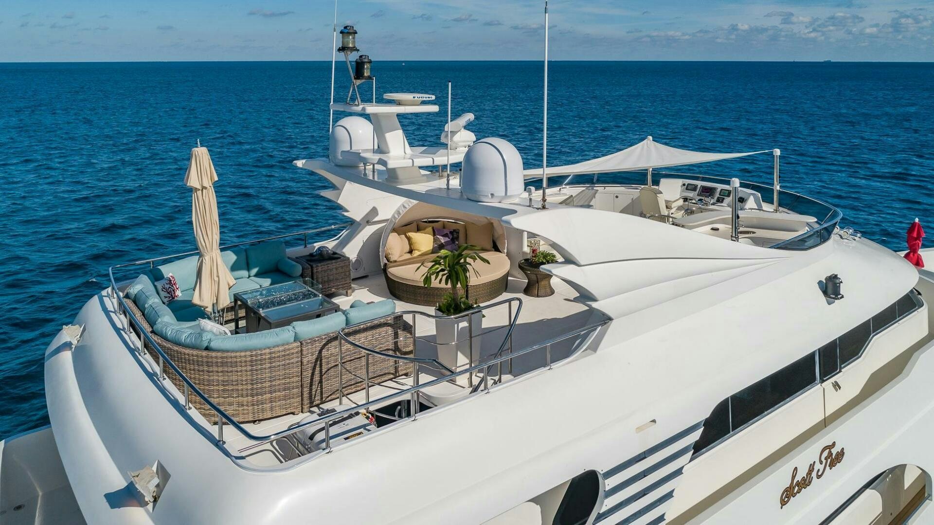 a boat with a plant on the front aboard SCOTT FREE Yacht for Sale