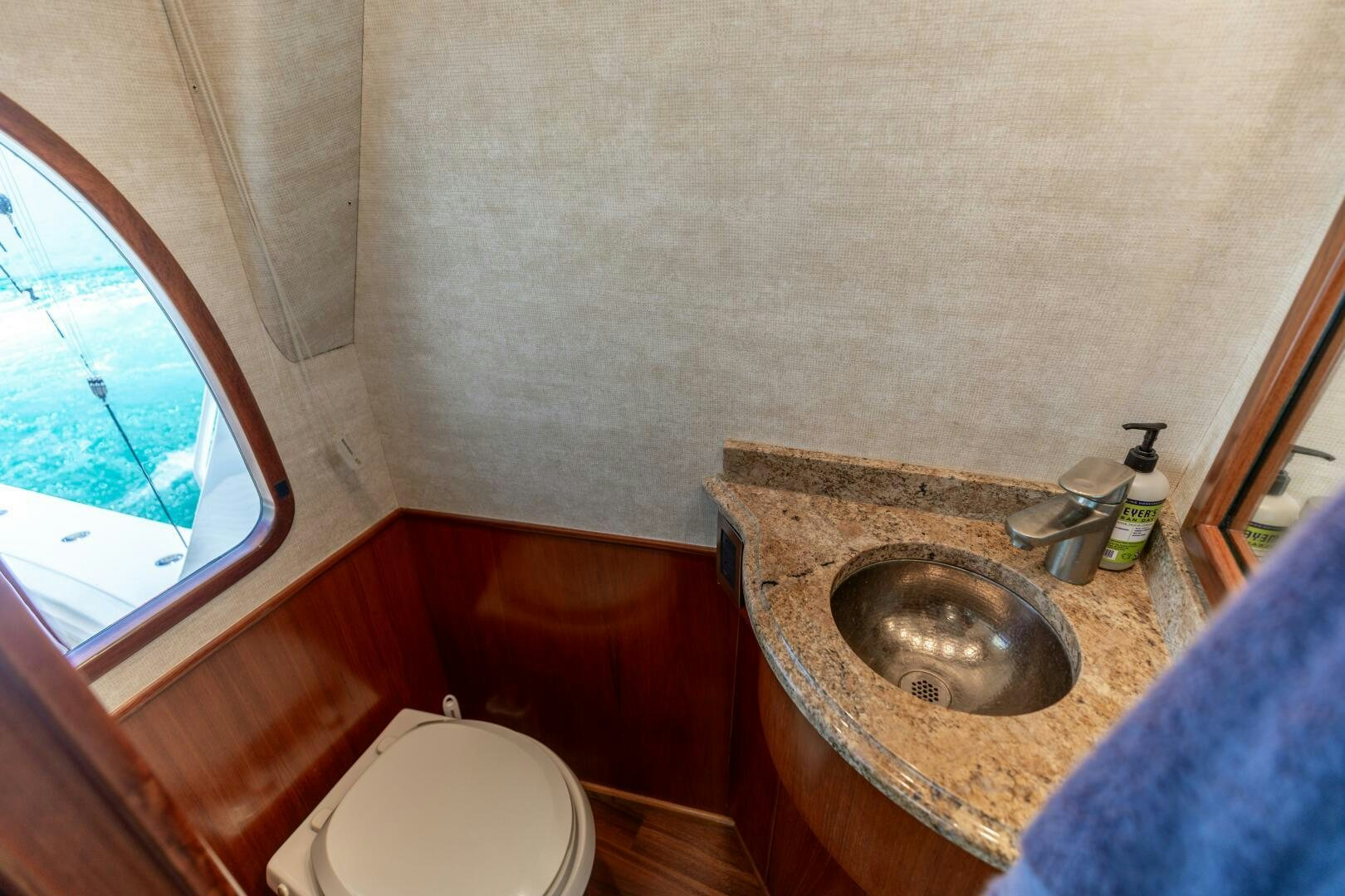 a bathroom with a sink and a toilet aboard SMOOTH RIDE Yacht for Sale