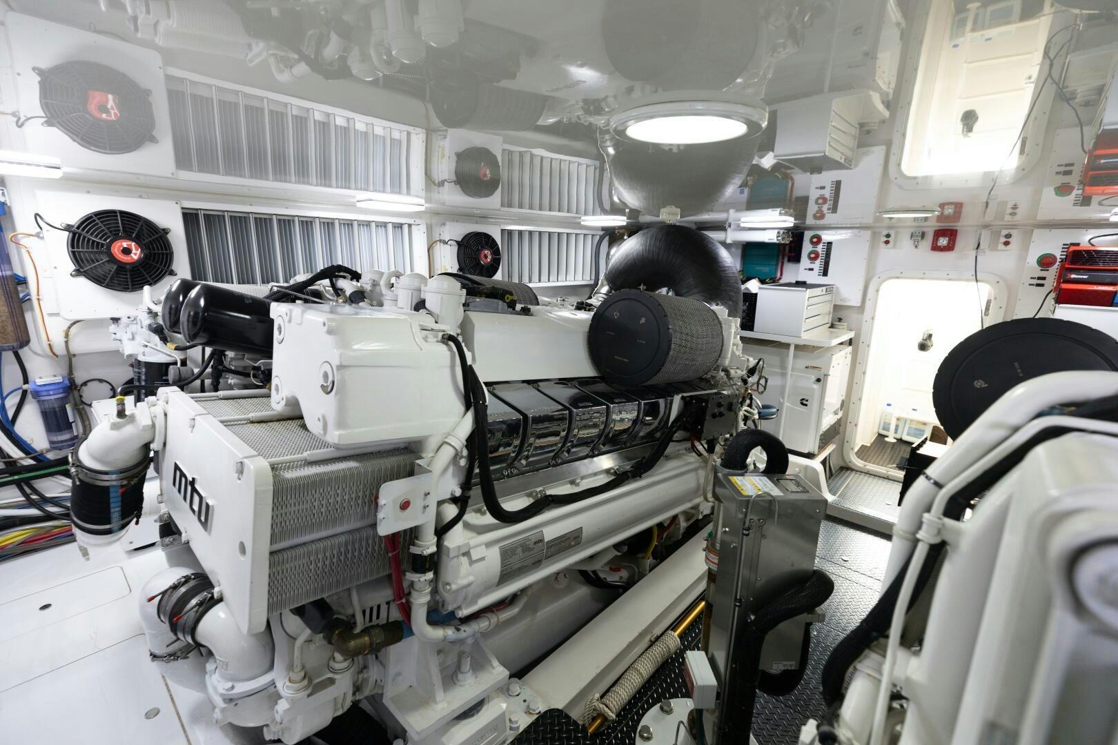 a room with a machine and other objects aboard SMOOTH RIDE Yacht for Sale