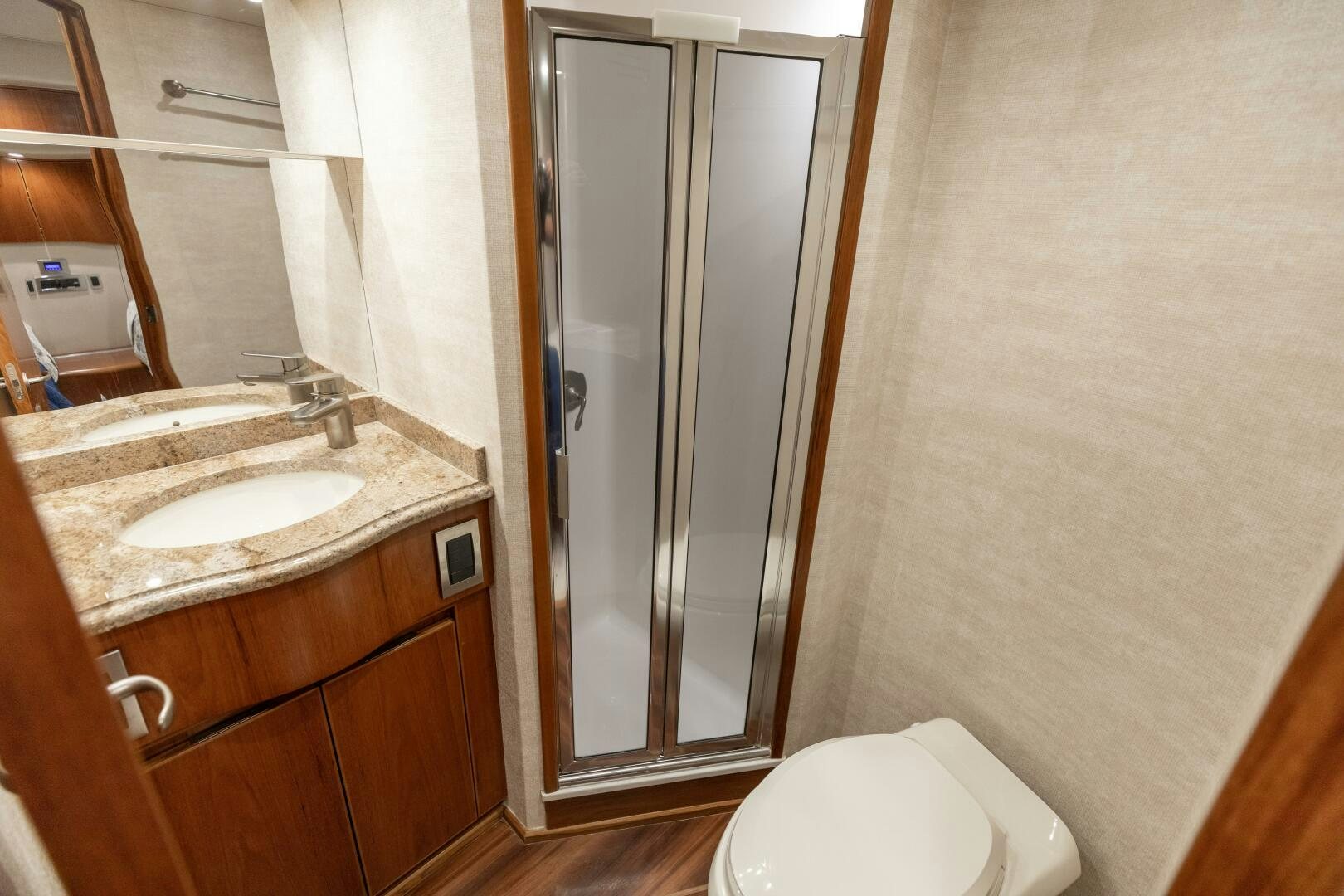a bathroom with a glass shower aboard SMOOTH RIDE Yacht for Sale