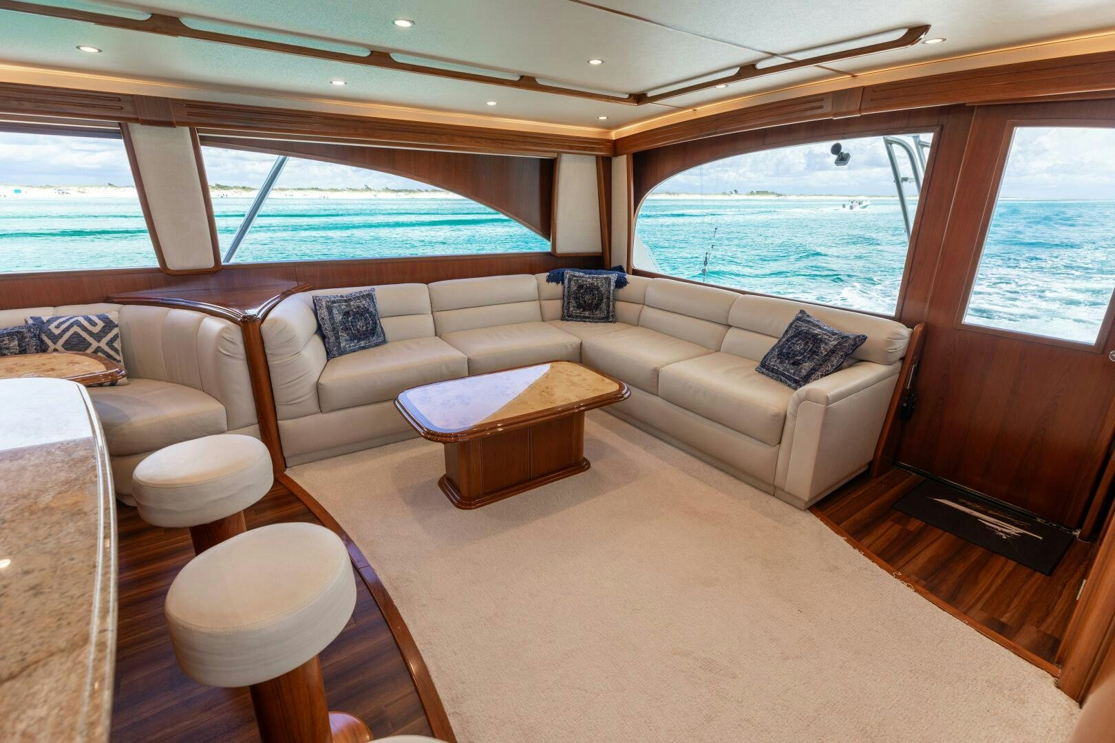 a living room with a couch and a table aboard SMOOTH RIDE Yacht for Sale