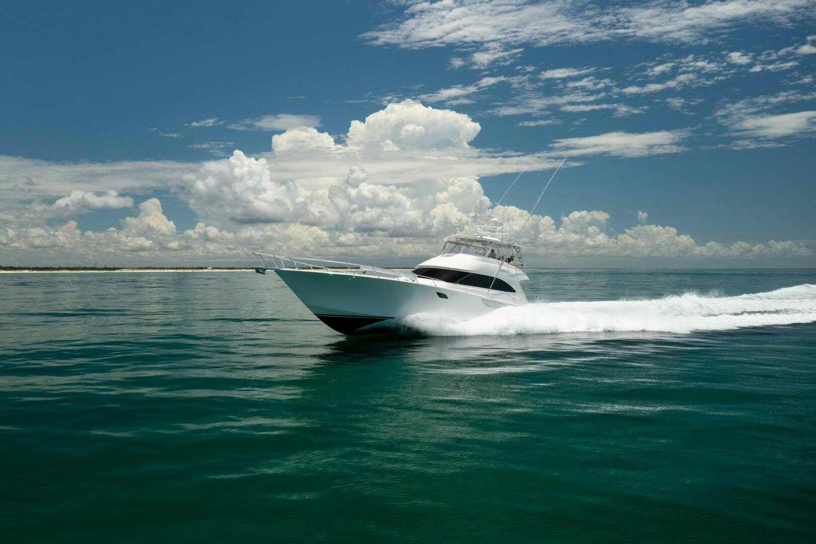 a white boat on the water aboard SMOOTH RIDE Yacht for Sale