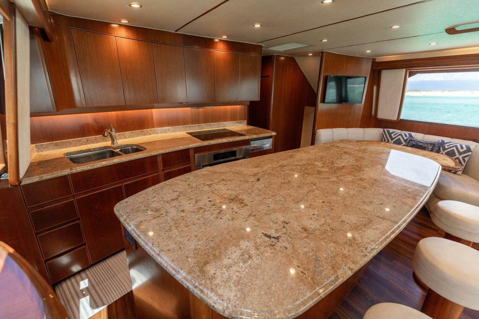 a large kitchen with wooden cabinets aboard SMOOTH RIDE Yacht for Sale