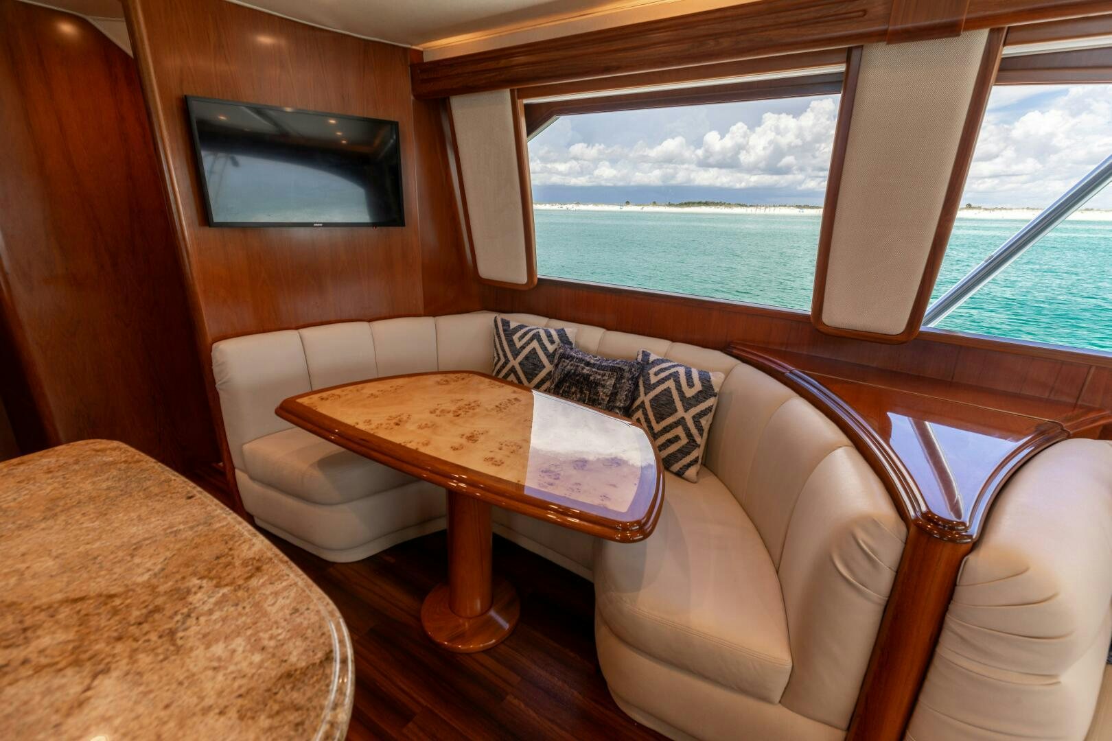 a room with a table and chairs aboard SMOOTH RIDE Yacht for Sale