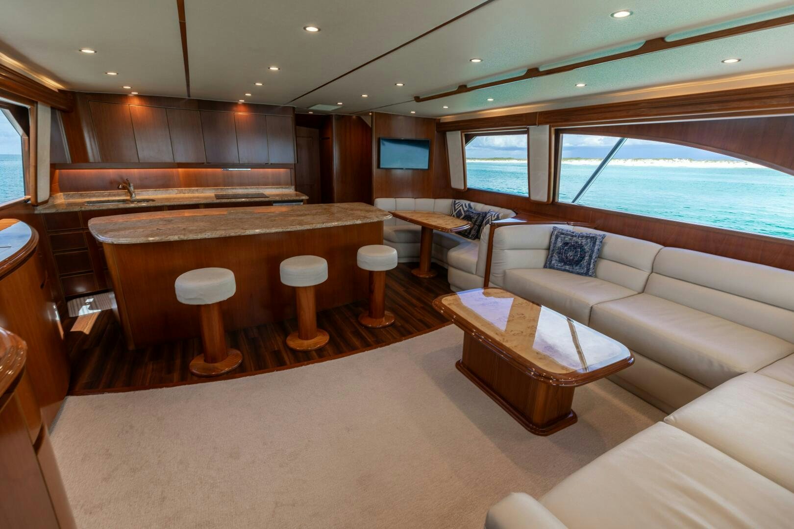 a room with a couch and a table aboard SMOOTH RIDE Yacht for Sale