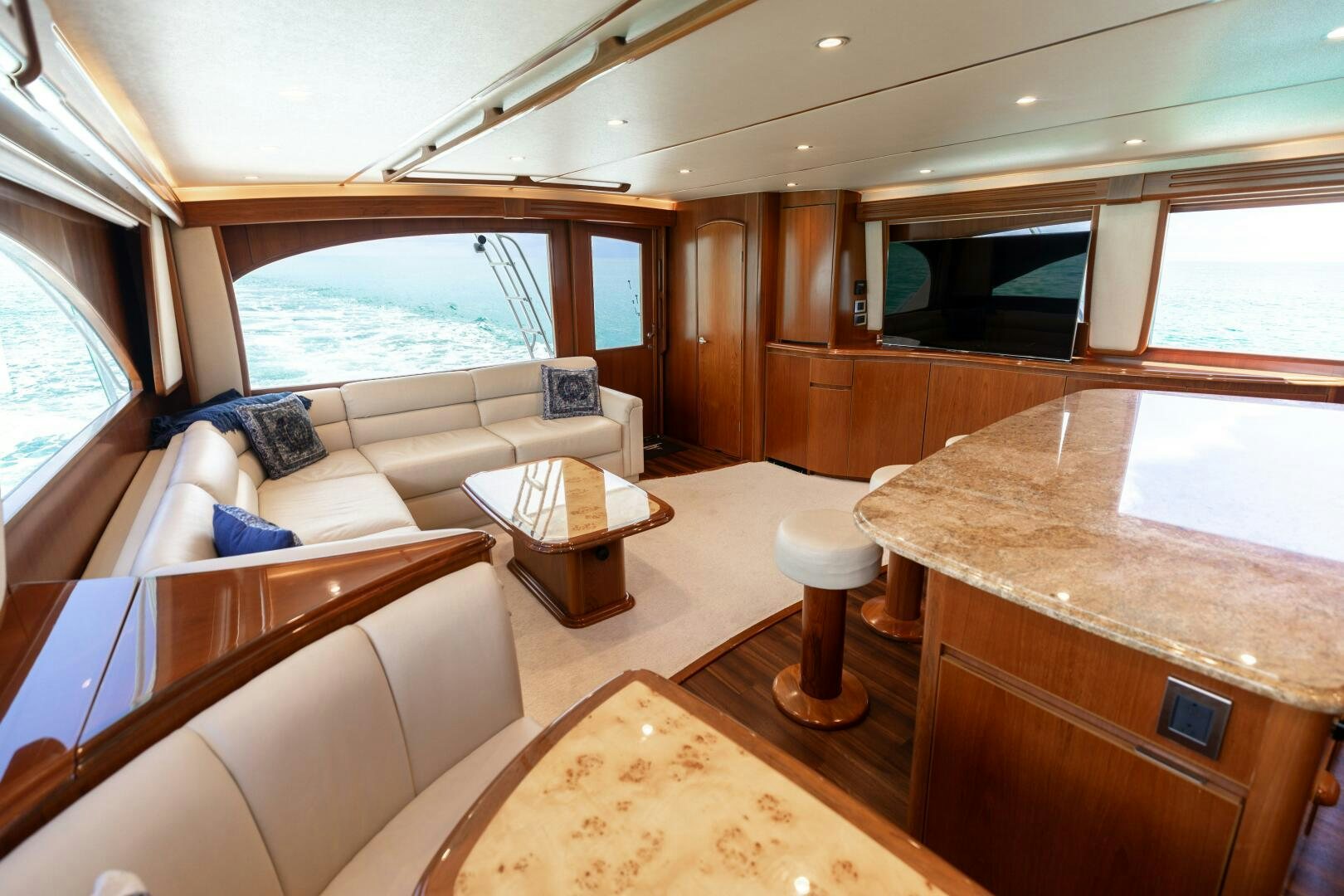 a living room with a couch and a table aboard SMOOTH RIDE Yacht for Sale