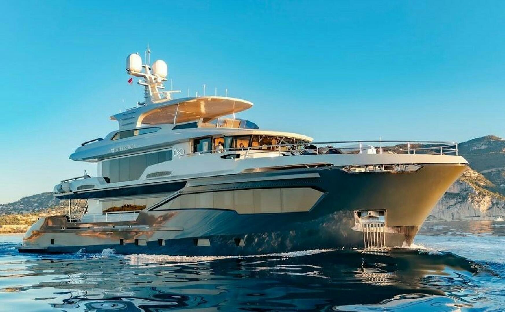 a large white boat on the water aboard INFINITY NINE Yacht for Sale
