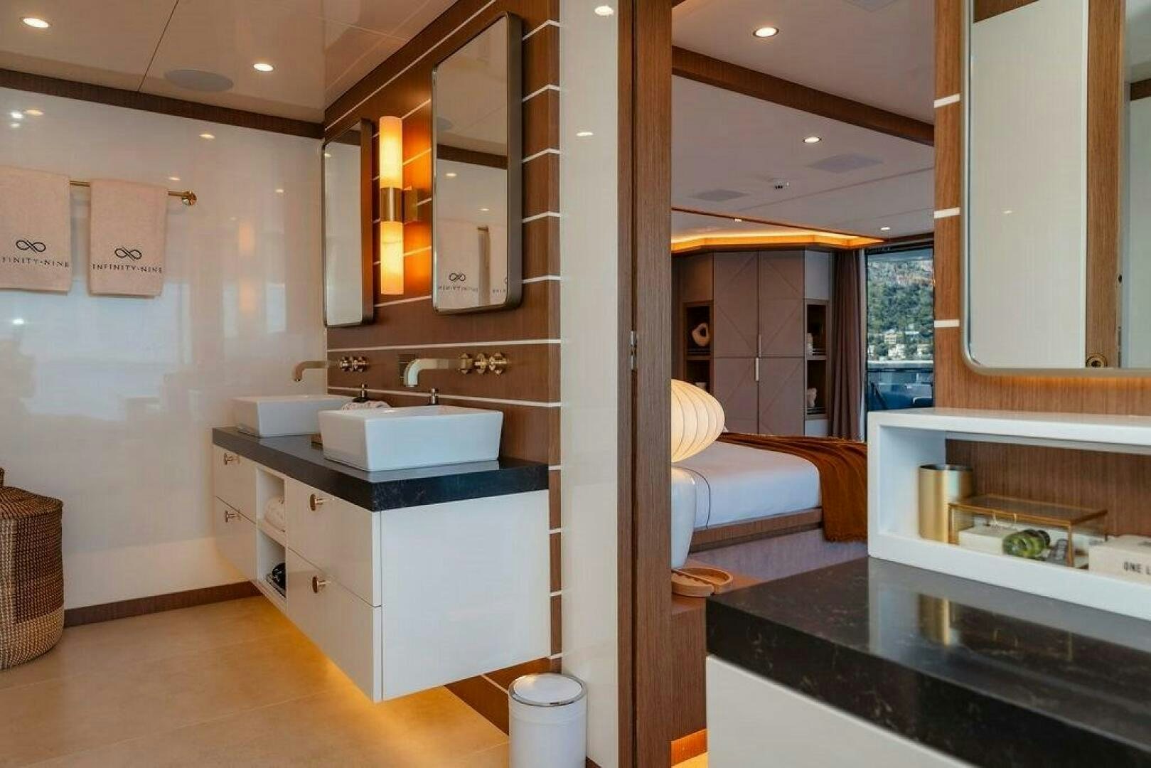 a bathroom with a sink and a mirror aboard INFINITY NINE Yacht for Sale