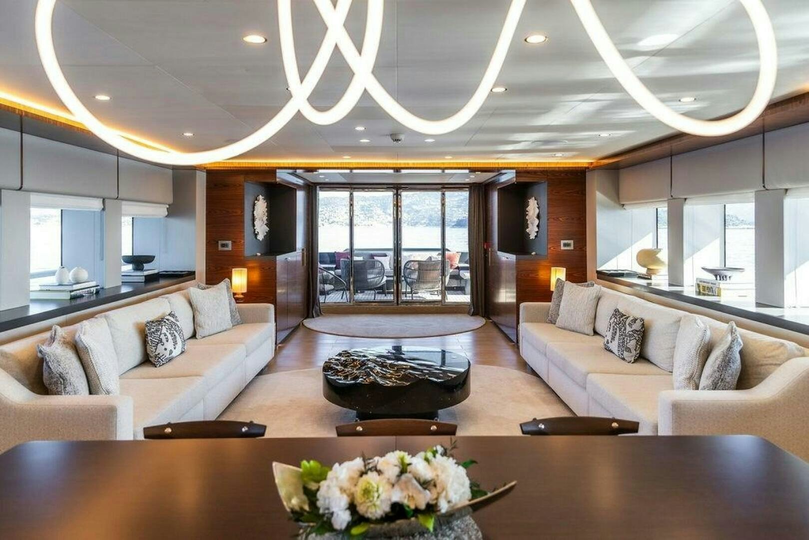 a living room with a large glass window aboard INFINITY NINE Yacht for Sale