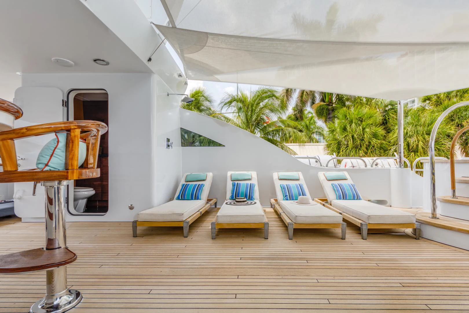 a room with a deck chairs and a pool table aboard ASPEN ALTERNATIVE Yacht for Charter