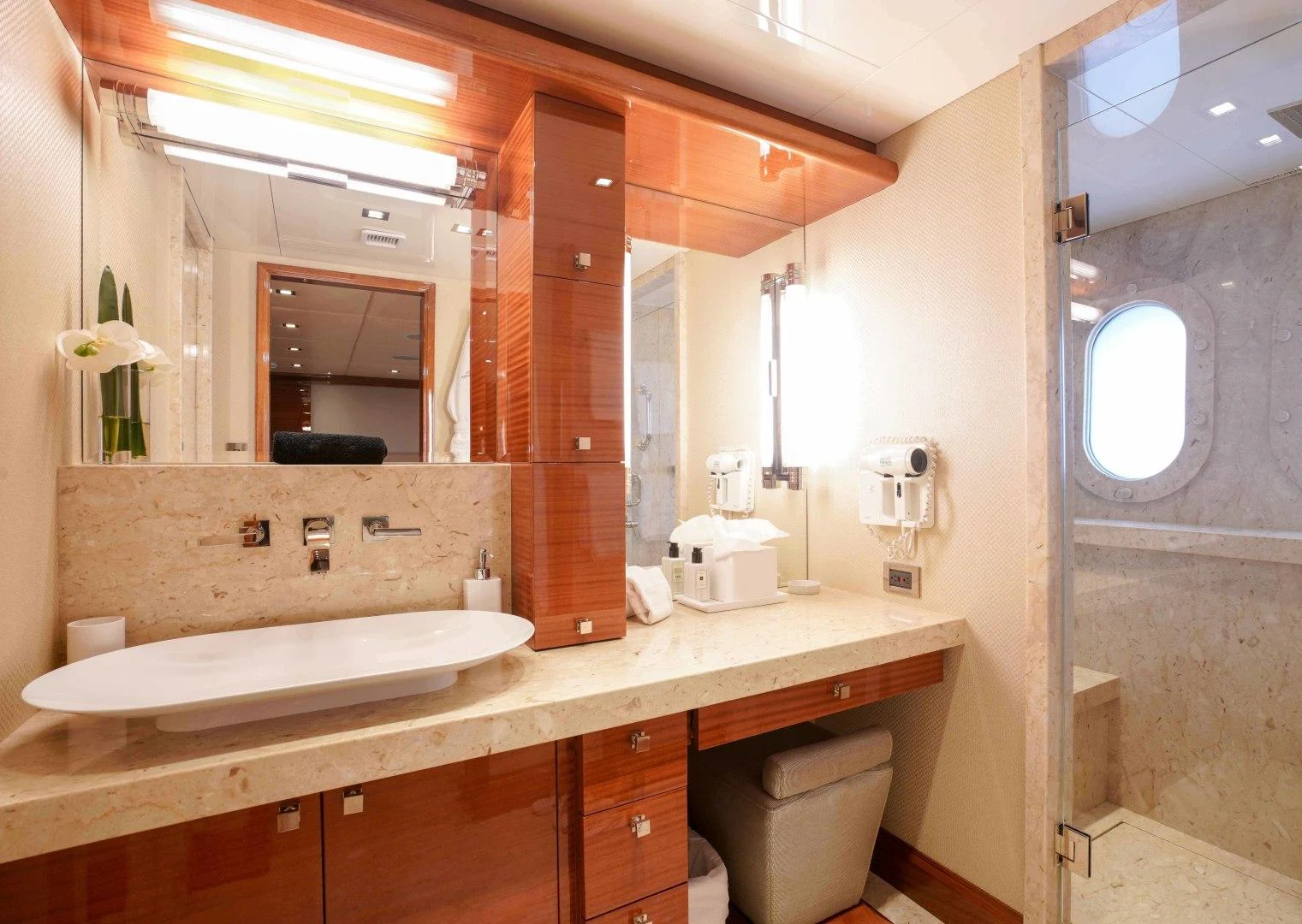 a bathroom with a sink and a mirror aboard ASPEN ALTERNATIVE Yacht for Charter
