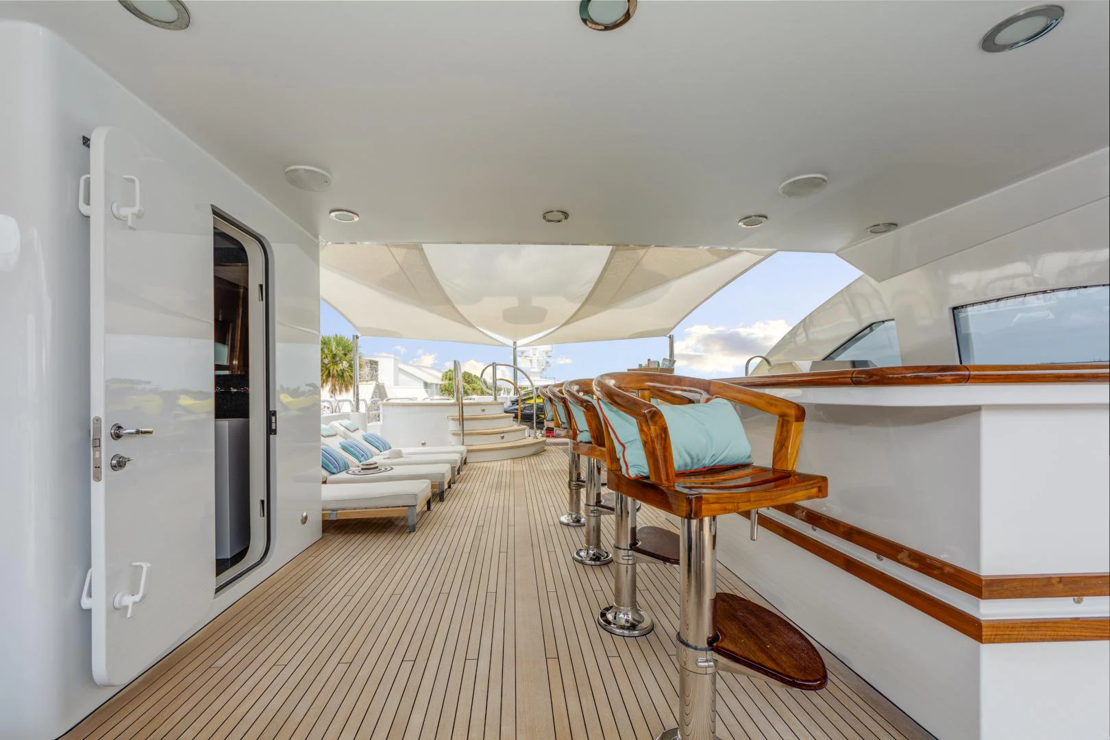 a room with a bed and a chair aboard ASPEN ALTERNATIVE Yacht for Charter