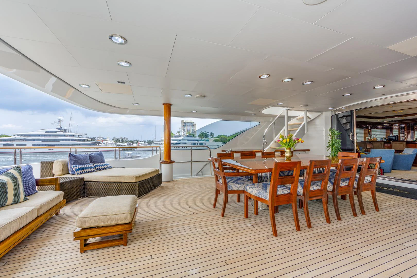 a room with a couch and a table and chairs aboard ASPEN ALTERNATIVE Yacht for Charter