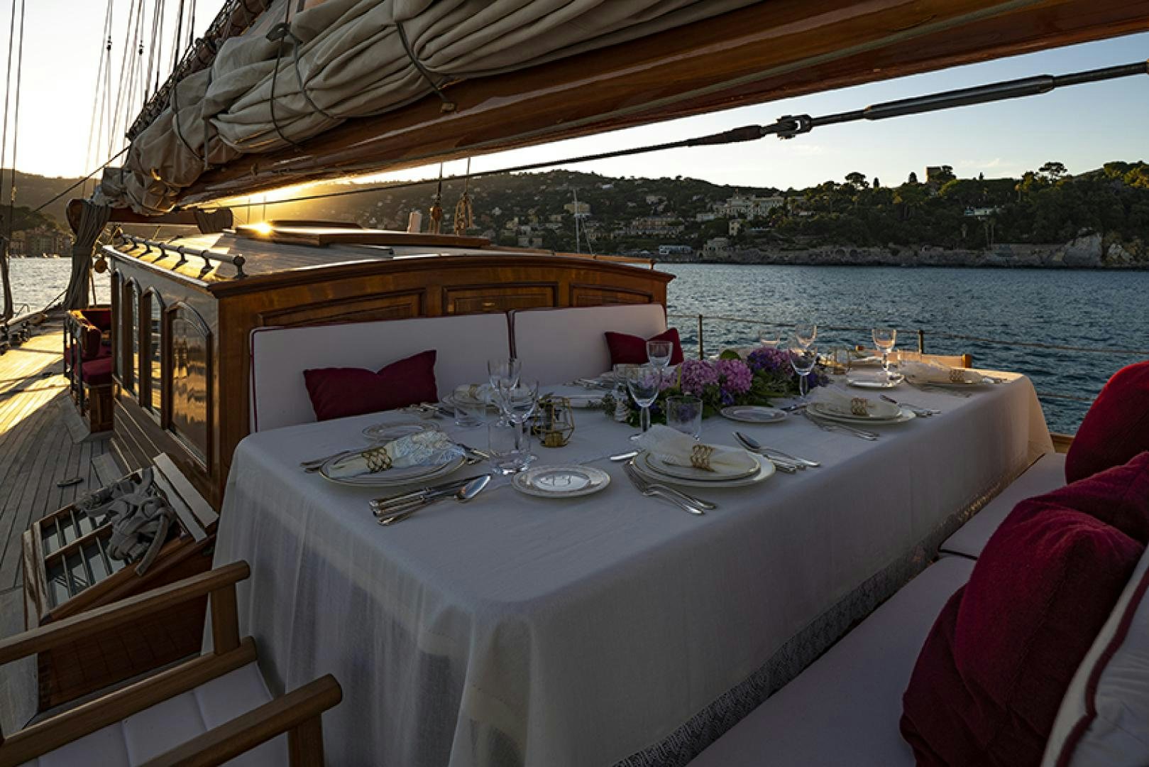 a table set for a dinner aboard INVADER Yacht for Charter