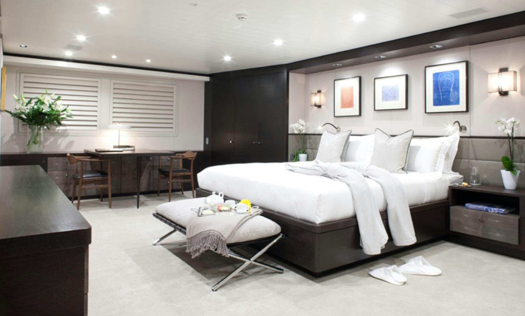 a large bedroom with a large bed aboard MIRAGE Yacht for Charter