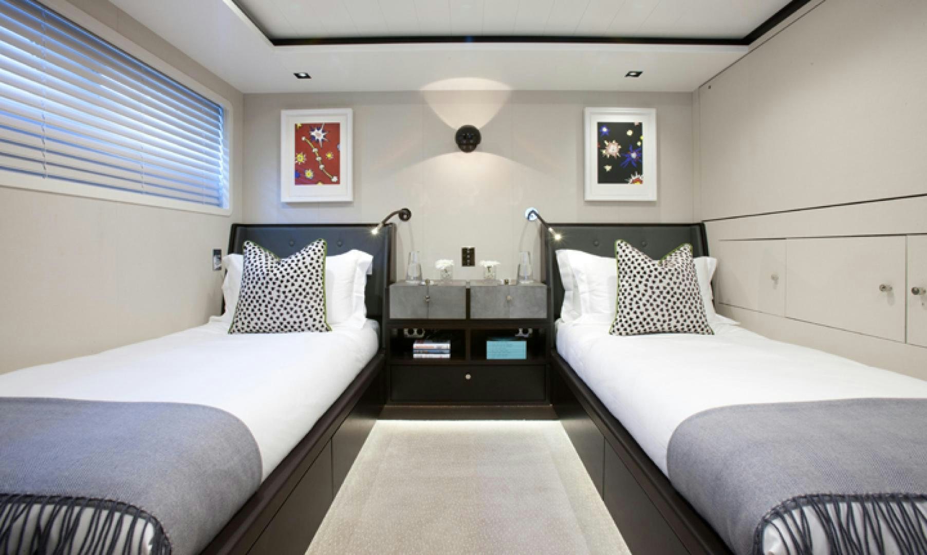 a couple of beds in a room aboard MIRAGE Yacht for Charter