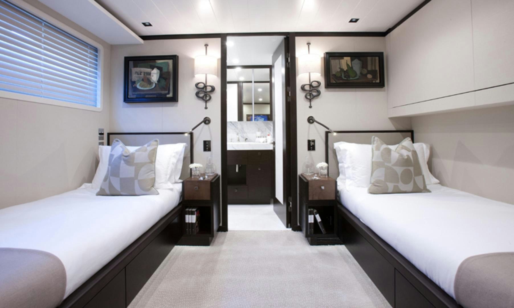 a room with two beds aboard MIRAGE Yacht for Charter