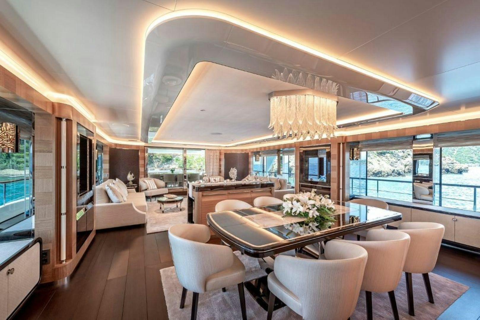 a large room with a table and chairs aboard SUNRISE Yacht for Charter