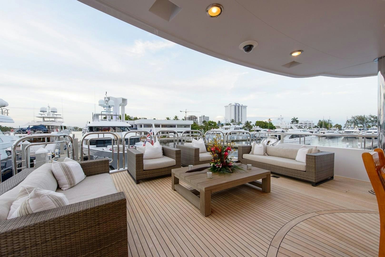 a room with a table and chairs aboard FAR FROM IT Yacht for Charter