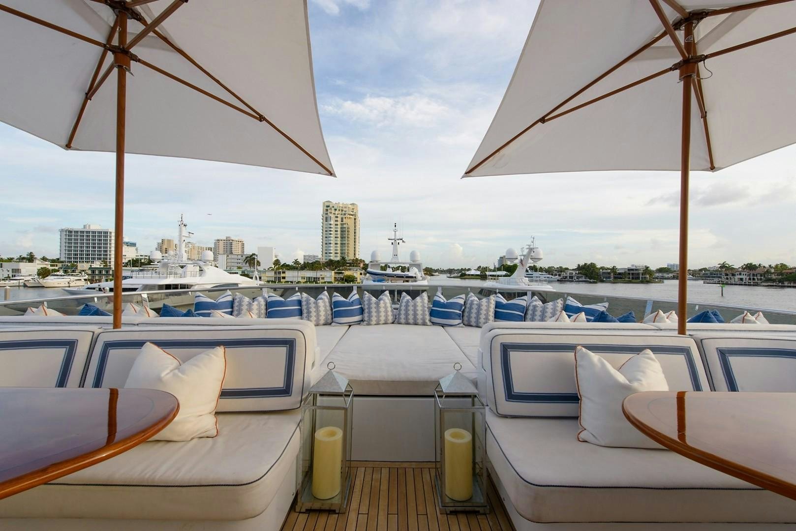a boat with umbrellas on it aboard FAR FROM IT Yacht for Charter