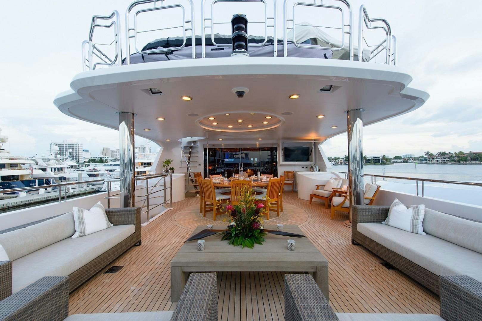 a room with a table and chairs aboard FAR FROM IT Yacht for Charter