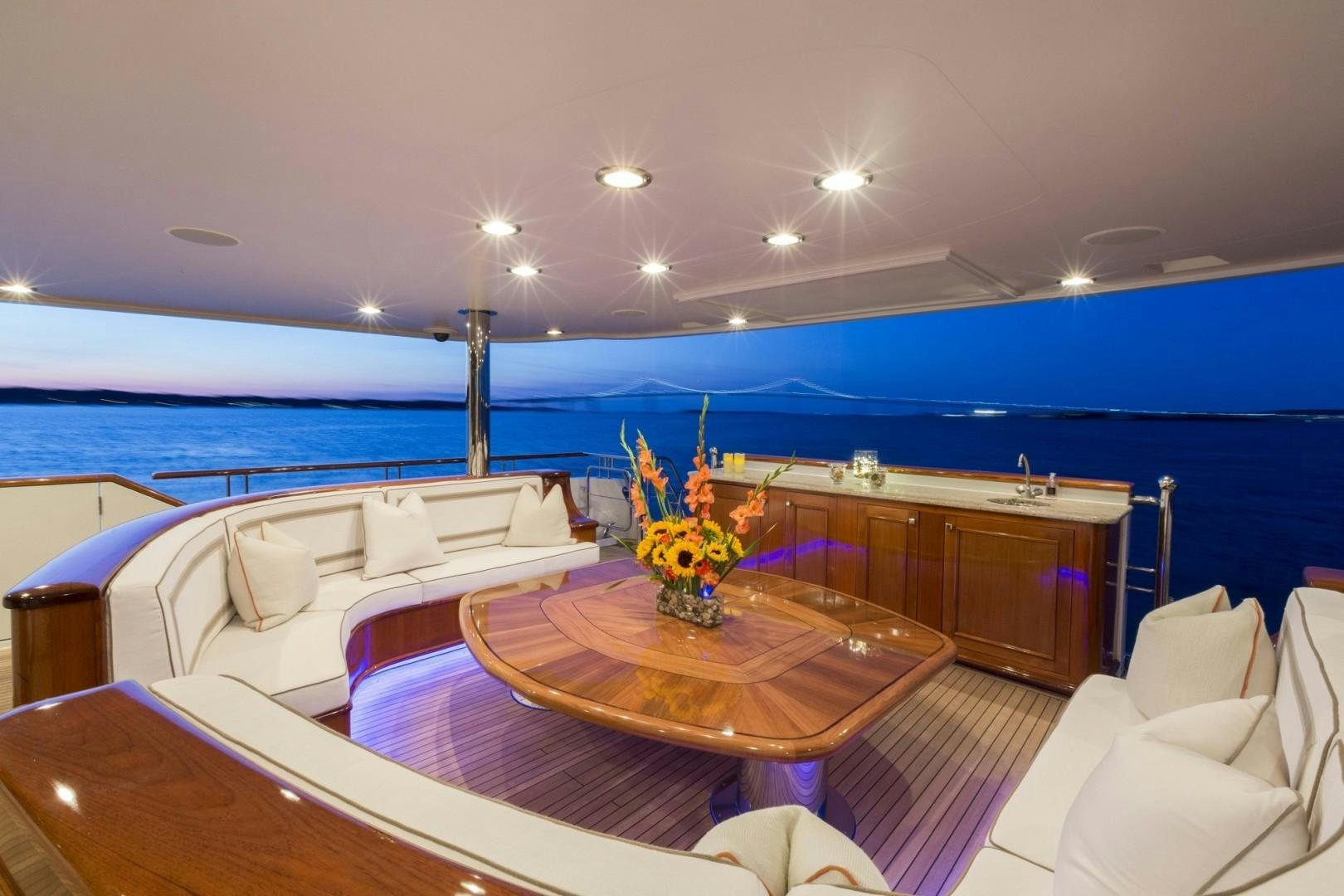 a large living room with a large pool aboard FAR FROM IT Yacht for Charter