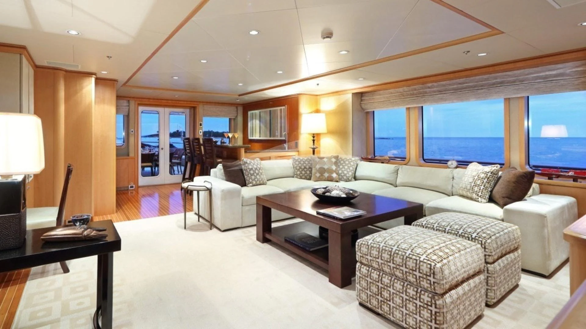 a living room with a large window aboard HELIOS 2 Yacht for Charter