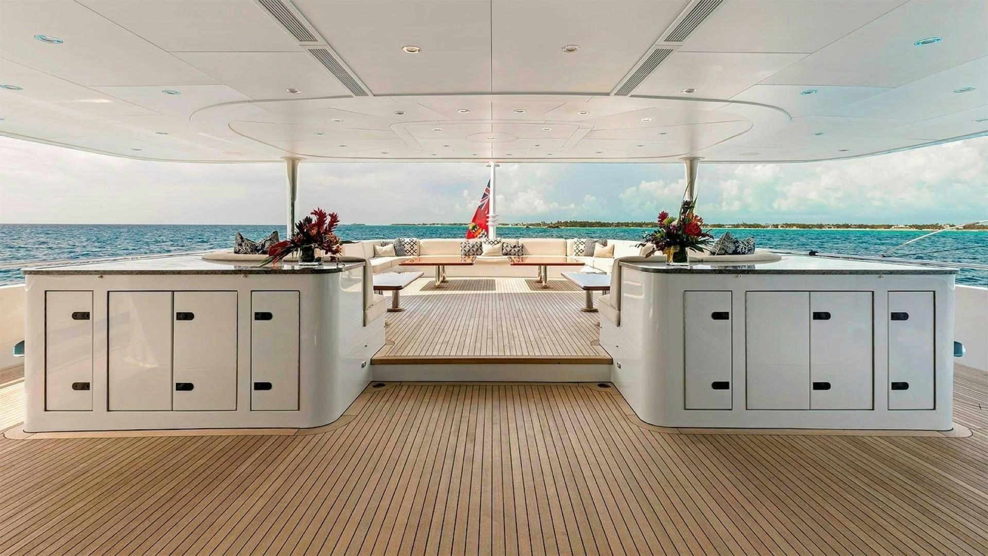 a room with white cabinets and white cabinets and a large body of water aboard LADY BETH Yacht for Charter