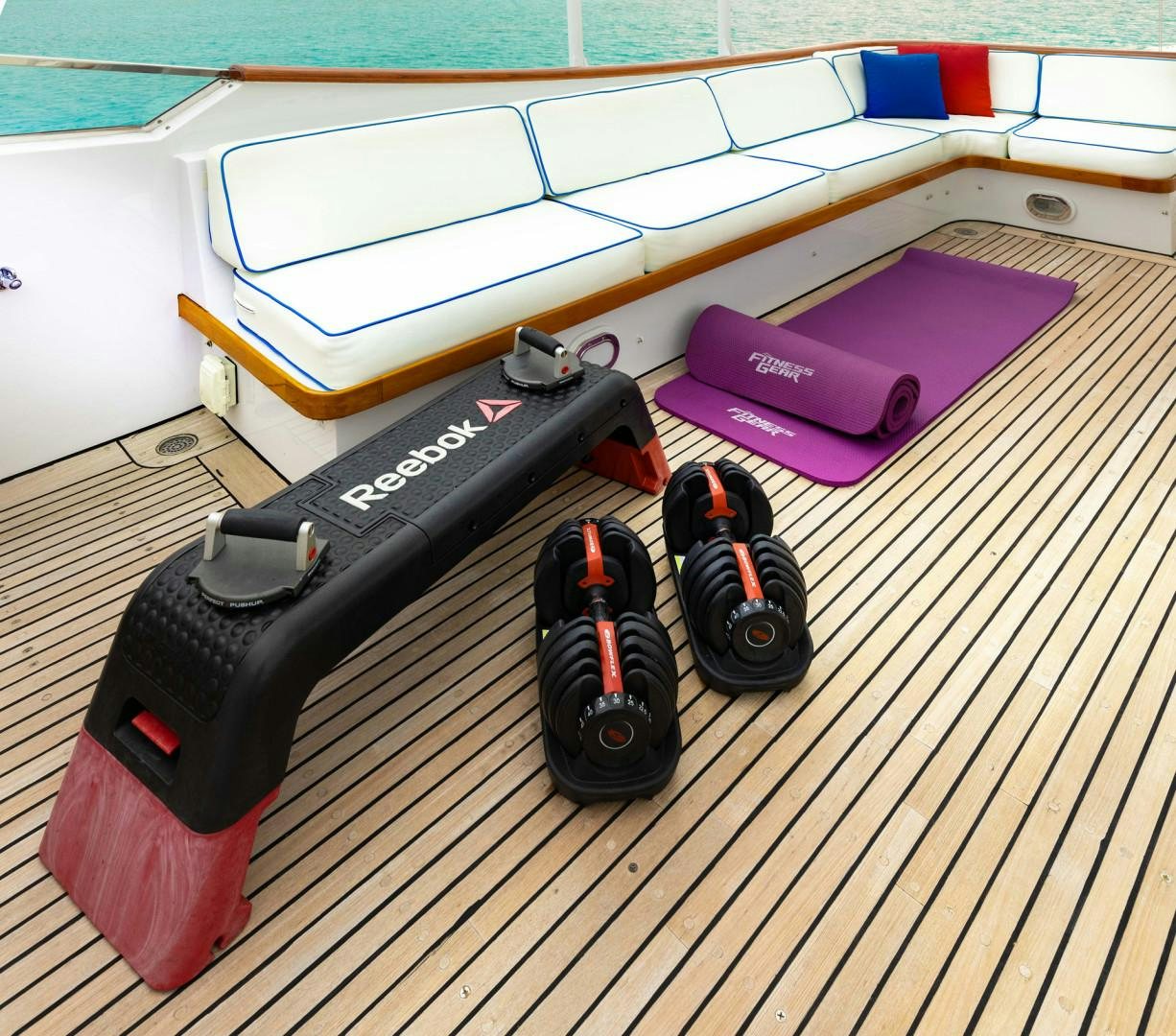 a black camera on a wooden surface aboard RENA Yacht for Charter