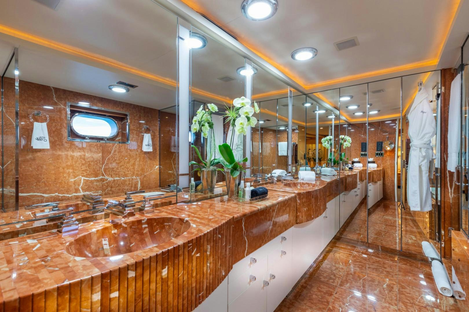 a large bathroom with a large countertop aboard RENA Yacht for Charter